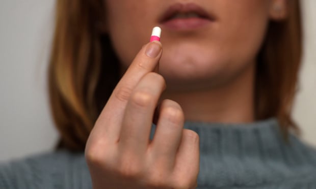 Person taking ibuprofen
