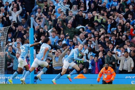 Haaland celebrates after scoring his team's second goal.