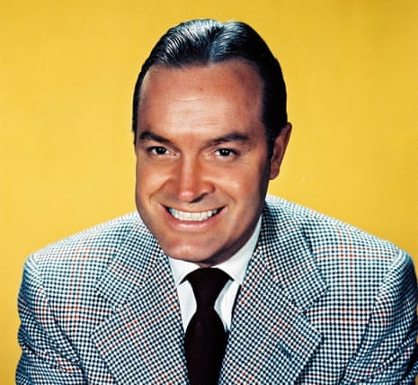 Bob Hope, actor and comedian, smiling in a studio portrait, against a yellow background, circa 1950