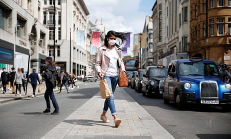UK Economy Expected To Grow By 7% As Lockdown Measures CeaseLONDON, ENGLAND - JULY 31: A shopper wearing a face covering crosses the street at Oxford Circus on July 31, 2021 in London, England. The United Kingdom, considered one of the advanced world’s worst hit economies by the pandemic, is predicted by the IMF to a 7% growth increase since Covid-19 lockdown measures were eased on 19th July. People are still expected to observe social distancing and wear masks but these are no longer mandatory. (Photo by Hollie Adams/Getty Images)