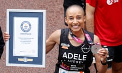 Adele Roberts with her Guinness World Records certificate after completing the race in 3hr 30min and 22sec