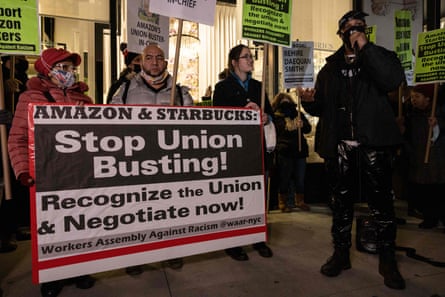 People rally in support of Amazon and Starbucks workers in New York City on 26 November 2021.