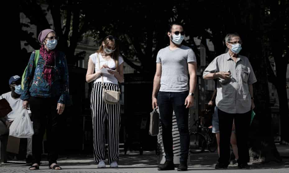 Commuters wearing masks at a tramway platform in Bordeaux, 20 July, 2020. 