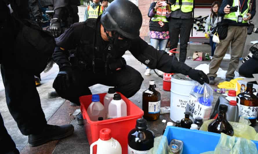 Explosives officers look at chemicals while searching for any remaining protesters hiding at the Hong Kong Polytechnic University.