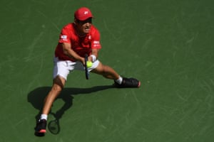 Yoshihito Nishioka stretches for a backhand return.