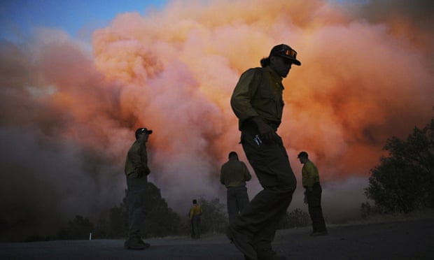 US forest firefighters try to contain Oak Fire burning east of Midpines in Mariposa County, California.