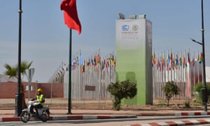 A Moroccan labourer drives a scooter at the site of the COP 22 in Marrakech