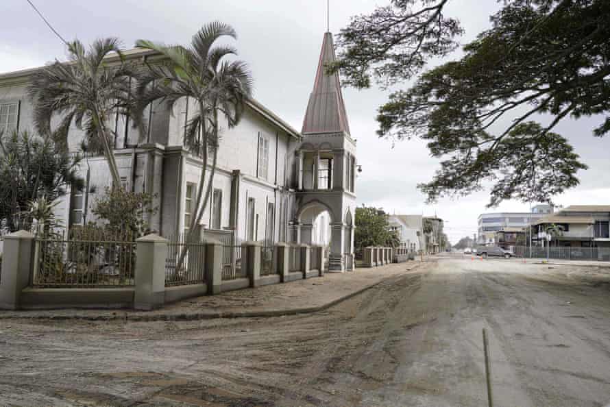 Volcanic ash covers the street next to the old prime minister’s office in Tonga’s capital Nuku’alofa.