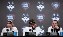 Paige Bueckers, Aaliyah Edwards and Nika Muhl of the UConn Huskies, from left, speak with the media after losing to the Iowa Hawkeyes in Friday's national semi-final in Cleveland.