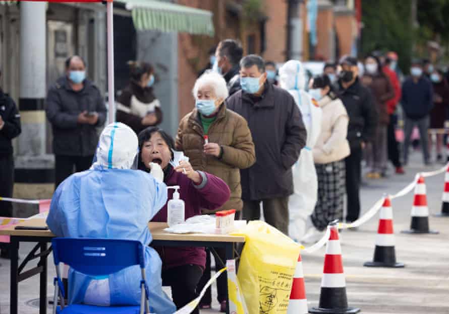 A medical worker conducts Covid tests in the Changning district of Shanghai.