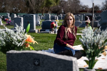 Karen Sutherland sits by her son’s gravesite at Park View Cemetery in Manteca, California, on 24 February 2024.