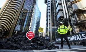 Insurance Rebellion activists protest outside the Lloyd’s building in London