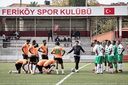 The teams before the beginning of a friendly match at Feriköy Stadium