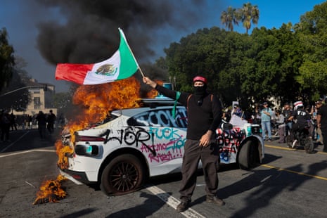 A Waymo self driving car burns as activists protest immigration raids in Los Angeles, California, USA, 08 June 2025.