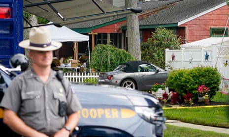 Authorities work outside as they search the home Asa Ellerup shared with her husband Rex Heuermann in Massapequa Park, Long Island, on Wednesday.