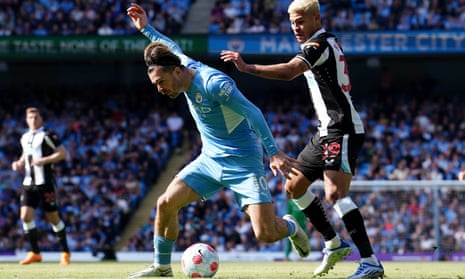 Jack Grealish playing for Manchester City up against Newcastle's Bruno Guimarães