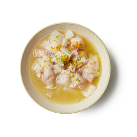 Dice the fish evenly, then marinate in lime and orange juice.
