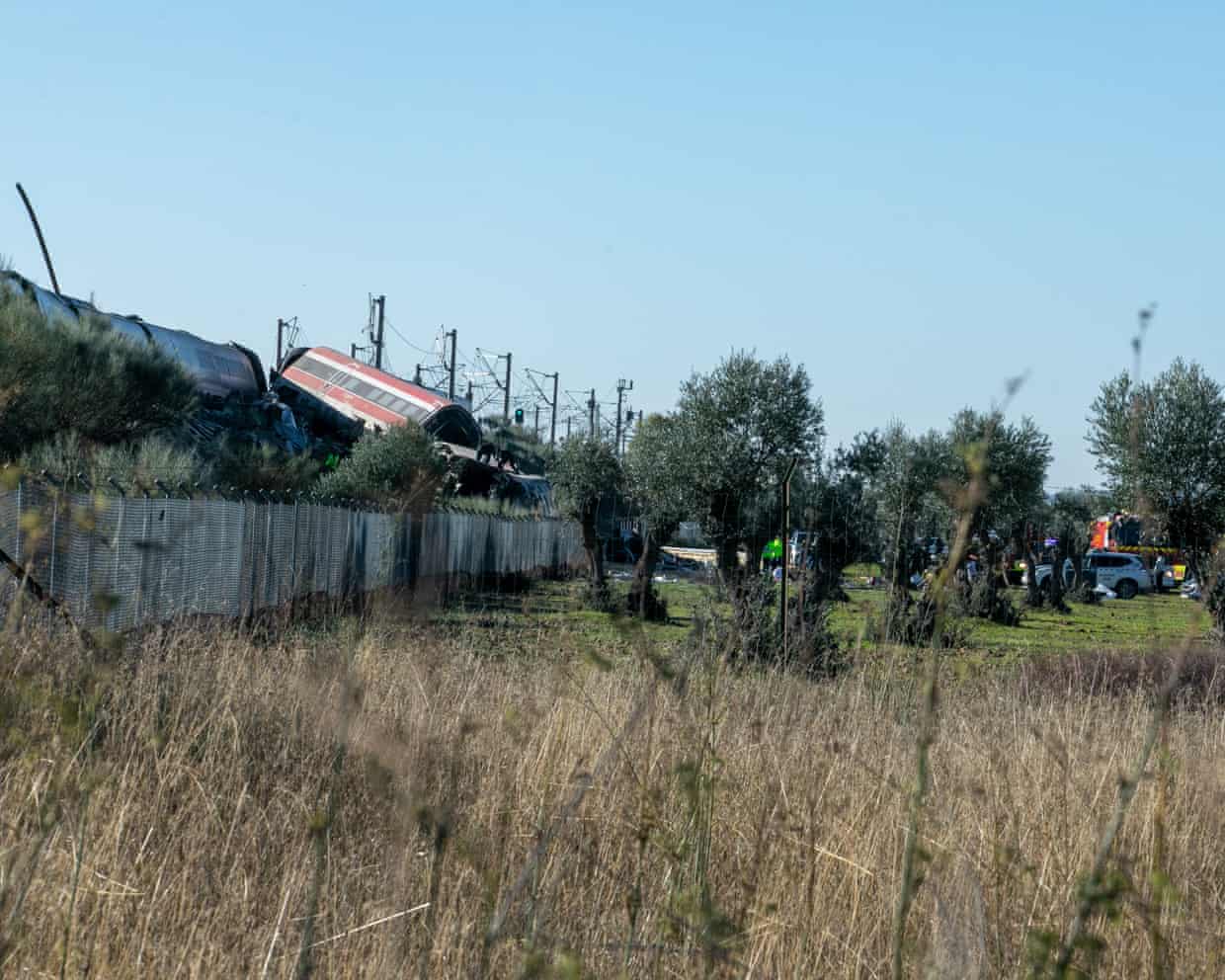 View from across a field of the train crash scene