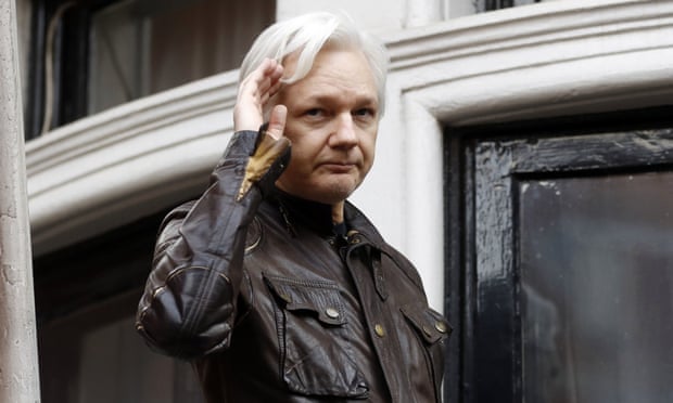 Julian Assange greets supporters from a balcony of he Ecuadorian embassy in London on 19 May 2017. 
