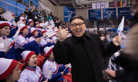 Kim Jong-un, aka Howard from Australia, stands in front of North Korean cheerleaders.