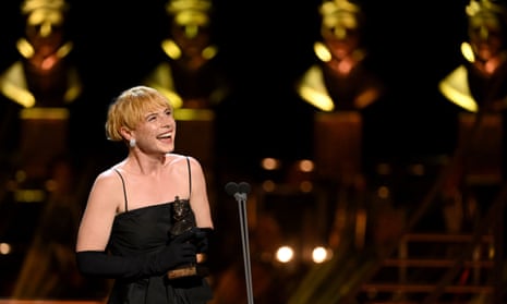 Jessie Buckley accepts the award for best actress in a musical.
