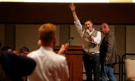 White nationalist leader Richard Spencer of the National Policy Institute waves goodbye after his speech.