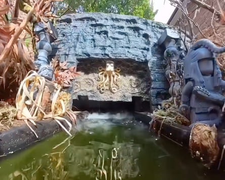 the theme park boat ride in Burton’s garden.