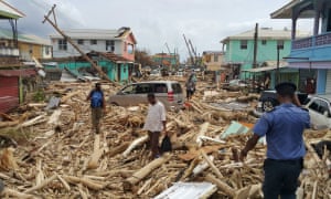 Residents of Roseau, Dominica, survey the damage caused by Hurricane Maria.