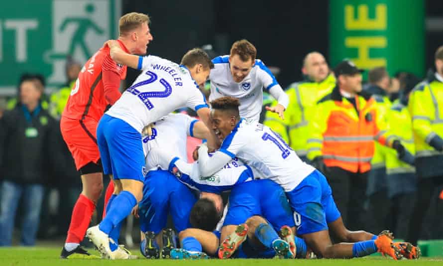 Portsmouth players celebrate André Green’s dramatic late winner at Norwich.
