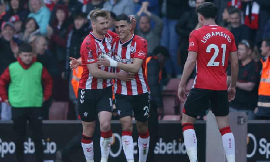 Southampton’s Stuart Armstrong, Mohamed Elyounoussi and Tino Livramento celebrate their first goal, an own goal scored by Manchester City’s Aymeric Laporte.