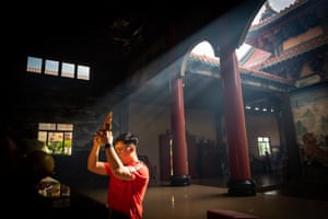 A Chinese-Indonesian man prays