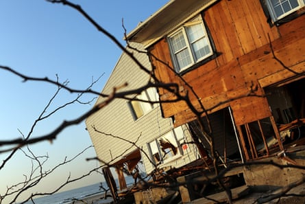 Destroyed beach homes stand in the heavily damaged Rockaway neighborhood 12 days after Superstorm Sandy slammed into parts of New York and New Jersey, on 12 November 2012.