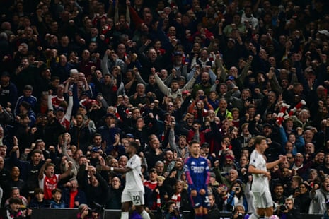 Arsenal fans celebrate on the final whistle as their team beat Fulham 1-0.