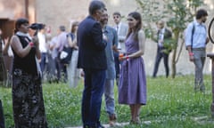 Amanda Knox, right, and her boyfriend, centre, talk with a guest at the opening of a conference on wrongful convictions in Modena