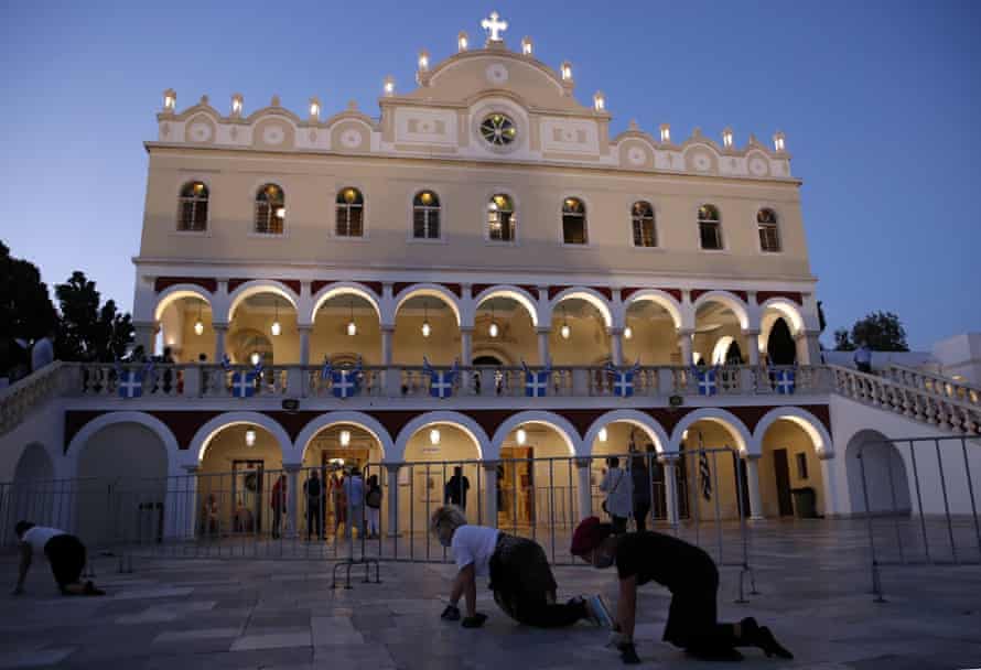 Pilgrims crawl in front of the Holy Church of Panagia of Tinos, on the Aegean island of Tinos, Greece, on Friday, 14 August, 2020. For nearly 200 years, Greek Orthodox faithful have flocked to Tinos for the 15 August feast day of the Assumption of the Virgin Mary, the most revered religious holiday in the Orthodox calendar after Easter. But this year there was no procession.