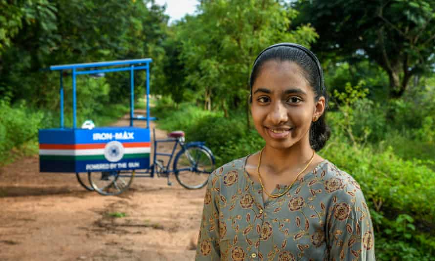 Vinisha Umashankar with the solar-powered ironing cart she designed, as featured in Costing the Earth.