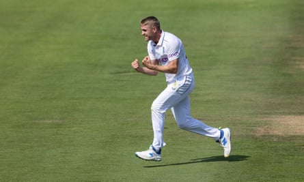 Olly Stone celebrates taking a wicket