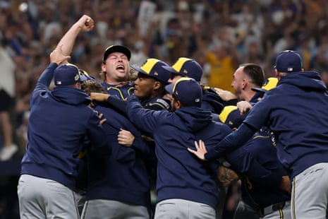 The Milwaukee Brewers celebrate with Trevor Megill after he recorded the final out to clinch the clubâÂÂs first World Series title at Tropicana Field on Wednesday.