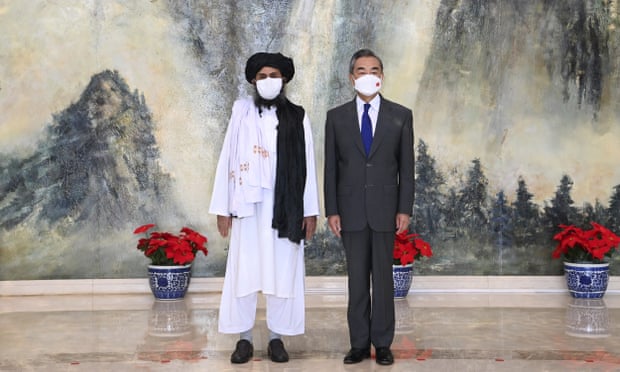 The Taliban co-founder Mullah Abdul Ghani Baradar (left) and Chinese foreign minister, Wang Yi, during a meeting in Tianjin, China, in July 2021.