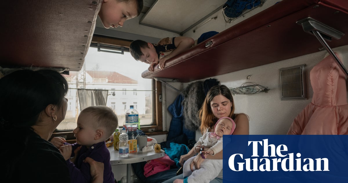 The people who keep the refugee trains running out of Ukraine – photo essay