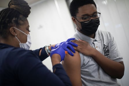 Cullen Veasley, 17, receives his second dose of the Covid vaccine at a mobile pop-up vaccination clinic in Detroit.