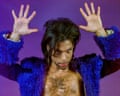 Prince with hands raised during cover shoot for Notorious magazine's 1999 New Year issue