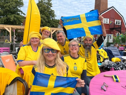 Members of the Soft Hooligans fans group get ready to support their team in August 2023.