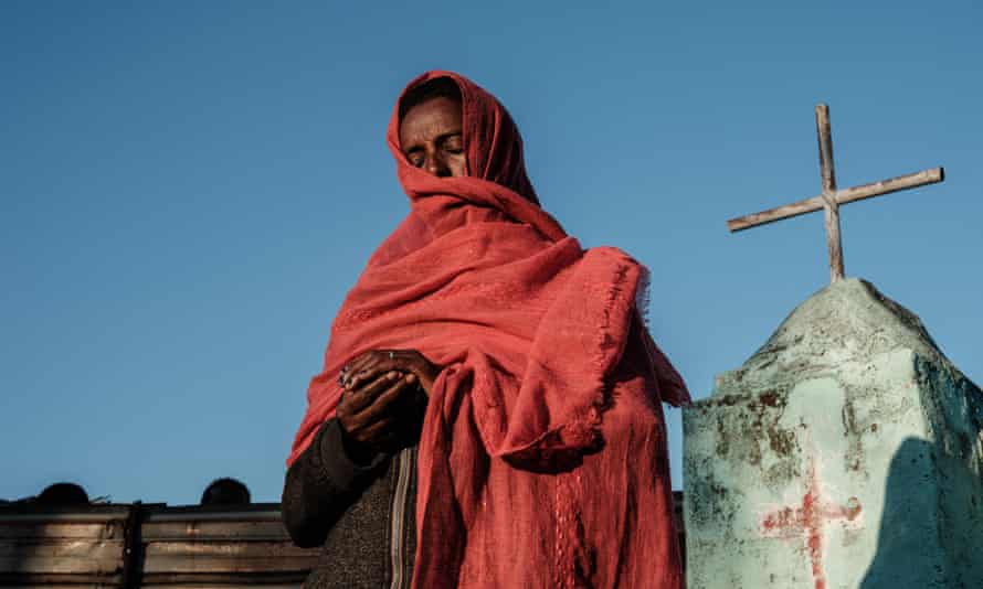 An Ethiopian refugee who fled the Tigray conflict prays during Sunday Mass at an Ethiopian Orthodox church in eastern Sudan.