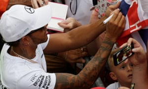 Mercedes’ Lewis Hamilton signs autographs for the tifosi at Monza and expects to renew his deal with the team before the end of the season.