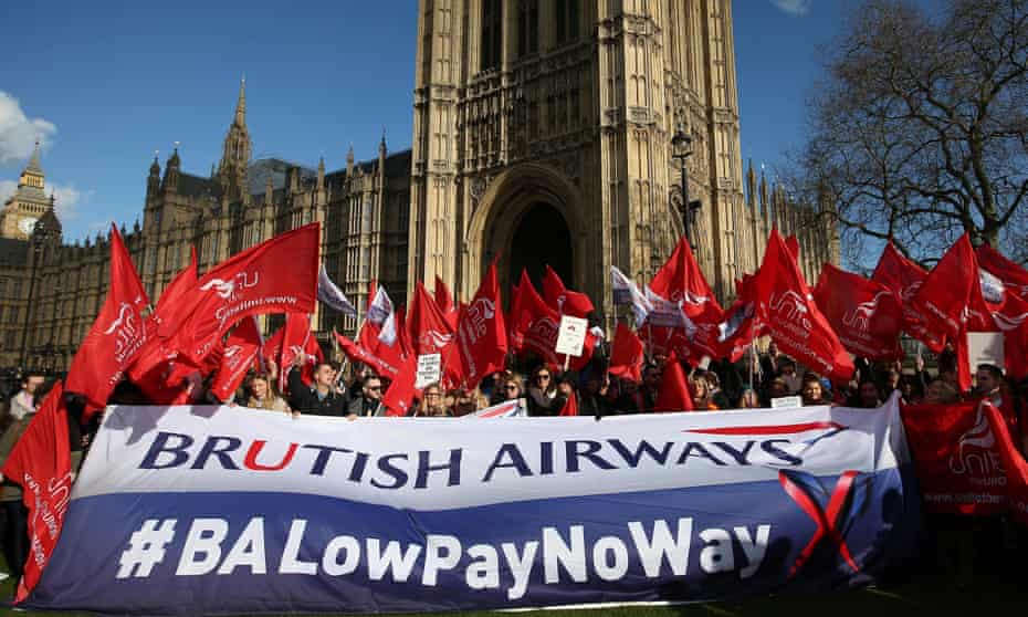 British Airways staff hold placards