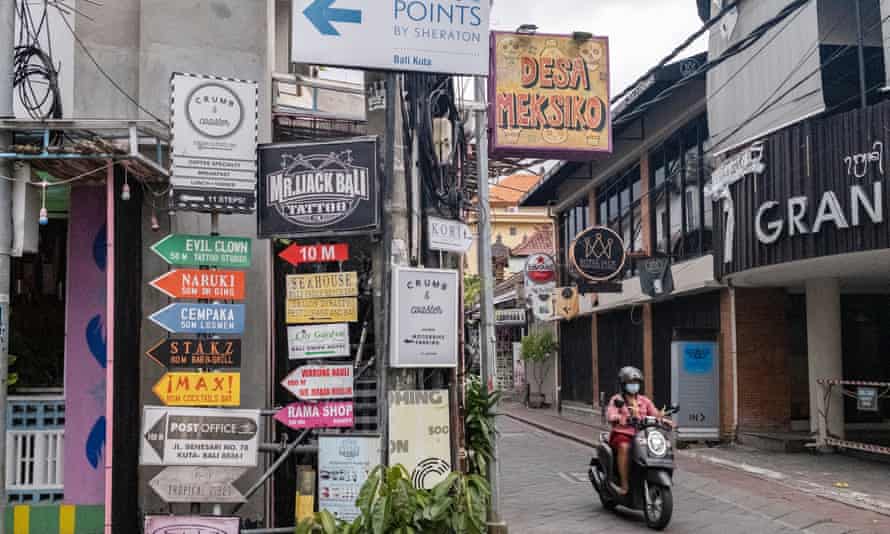 Person rides a motor bike in Bali