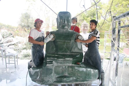 Workers carve the Jade Buddha in Thailand