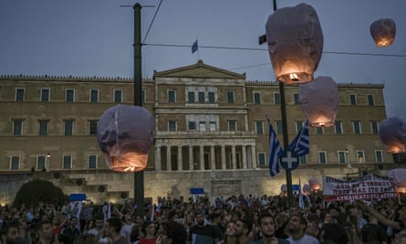 Protesters release hot air balloons in front of the Greek parliament as a tribute to the victims of the shipwreck.