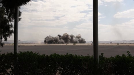 Smoke rises following an airstrike at Sanaa international airport in Yemen on 13 July.